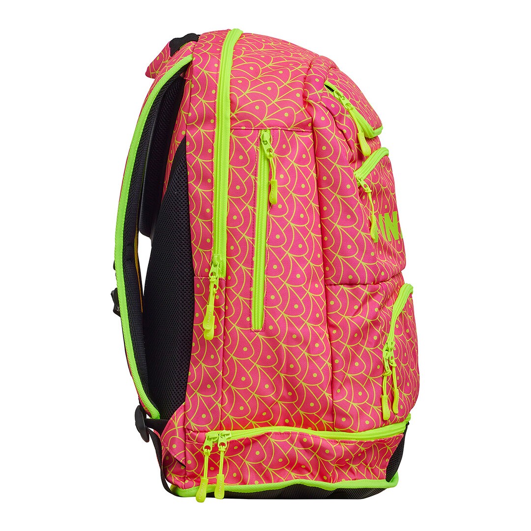 Side view of a pink and fluoro yellow Funkita backpack with multiple compartments and padded shoulder straps.
