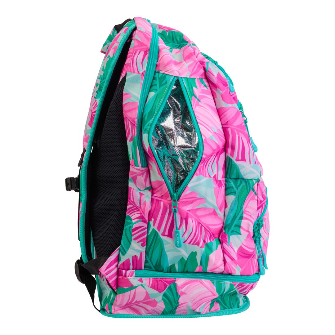 Side view of the pink and green tropic patterned Funkita Tropic Palm Elite Backpack showing multiple compartments and padded shoulder straps.