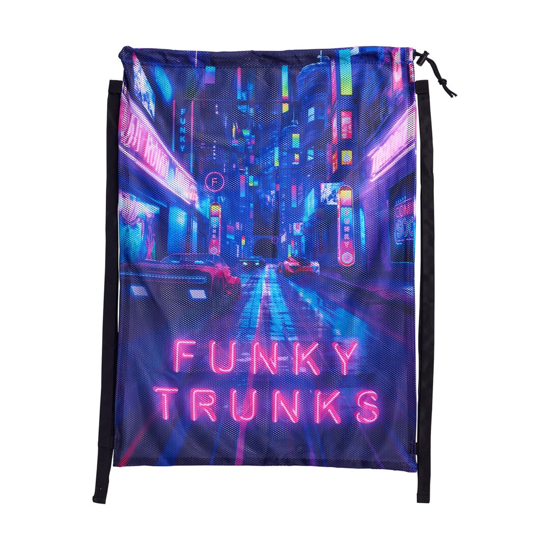 A mesh gear bag with a printed design featuring a cityscape at night with neon lights and the brand name 'Funky Trunks' prominently displayed.