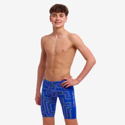 A boy wearing multicoloured Funky Trunks Much Munchies Boy's Training jammers.