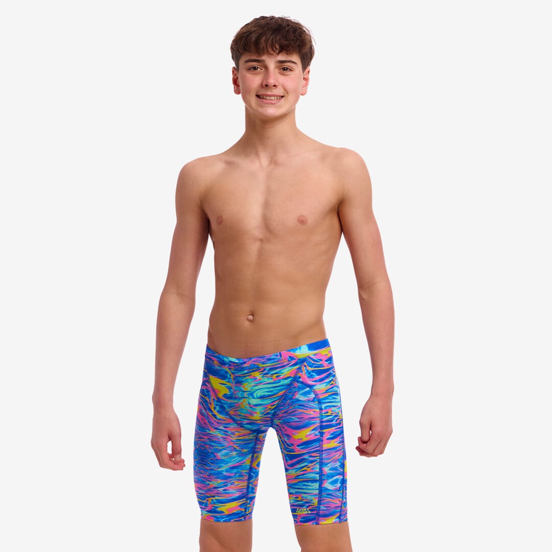 A boy wearing Funky Trunks Stir Crazy jammers