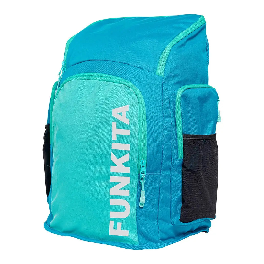 Mint coloured Space Case Backpack with multiple compartments, padded shoulder straps and 'Funkita' branding from an angled view