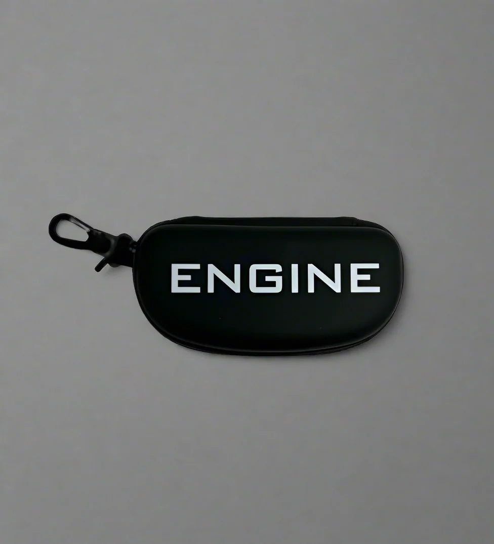 Swim goggle case, "ENGINE" branding, black with black trim, zipper closure, clip for attachment.