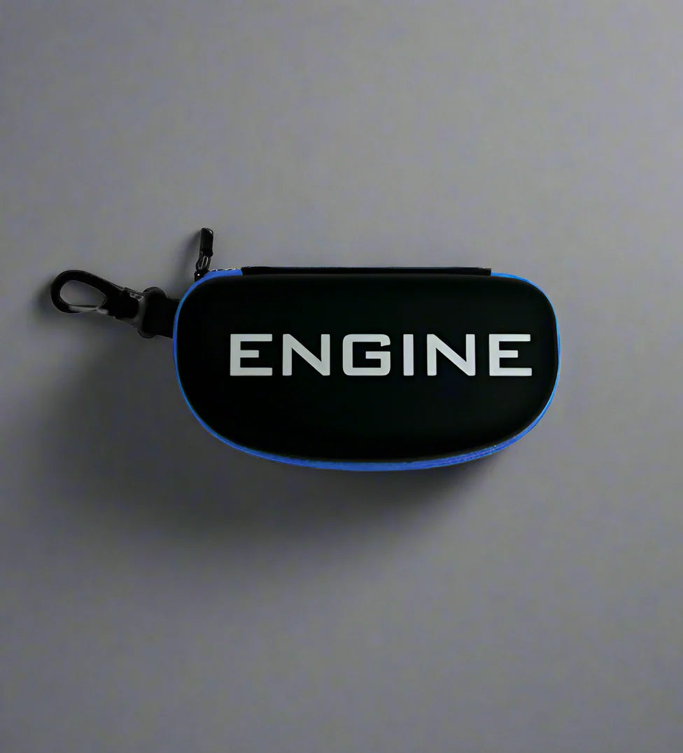 Black goggles case with "ENGINE" in bold white letters, blue trim, and a carabiner for easy attachment.