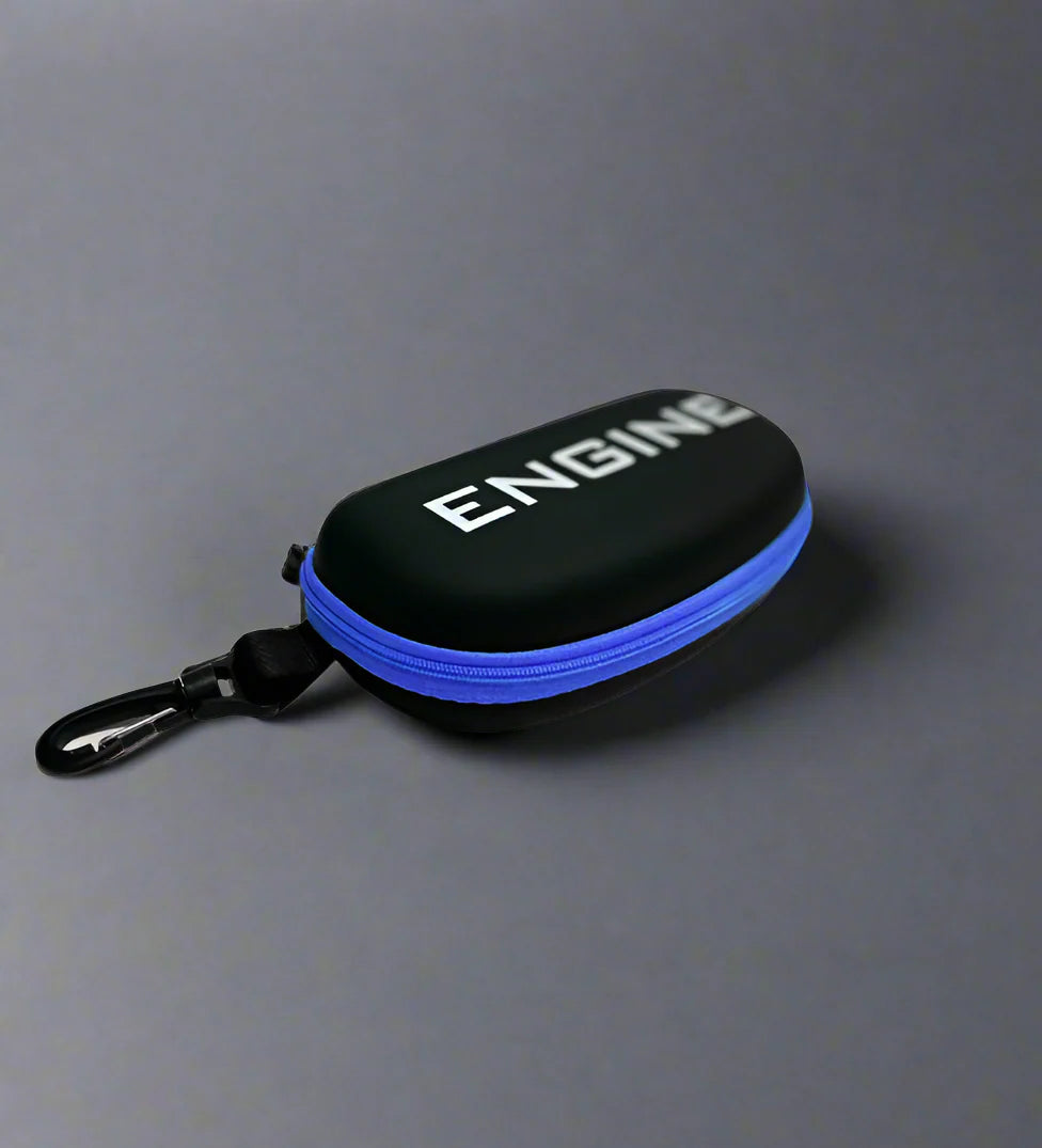 Side view of black goggle case with 'ENGINE' branding on and blue trim