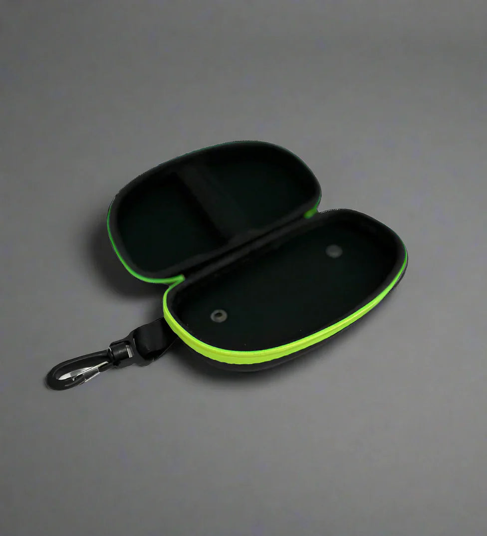 Open view of black goggle case with 'ENGINE' branding on and green trim