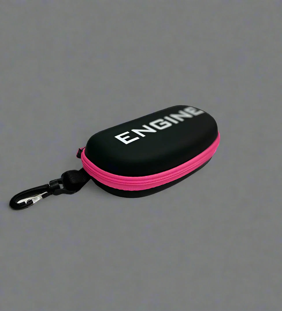 Side view of black goggle case with 'ENGINE' branding on and pink trim