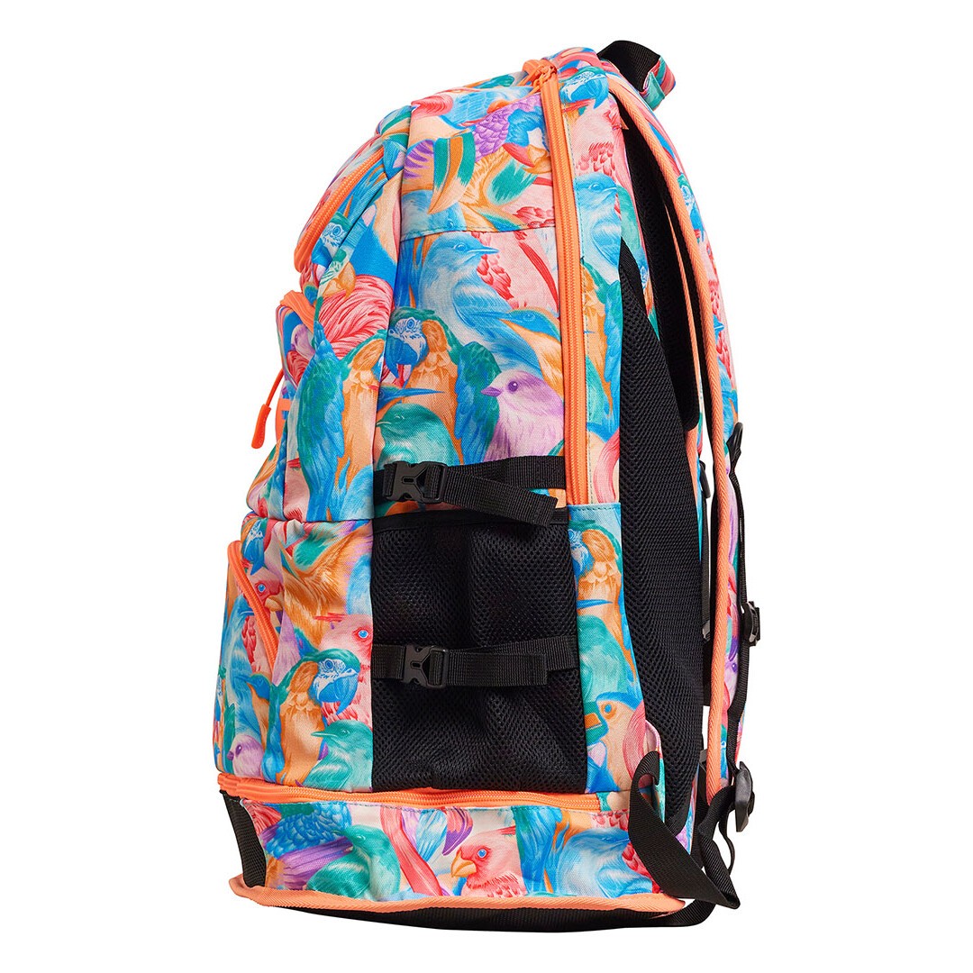 Sideview of multicolored Funkita backpack with a vibrant bird and foliage pattern, featuring multiple compartments and padded shoulder straps.