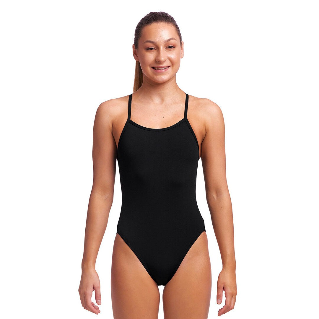Woman wearing a black swimsuit on a white background