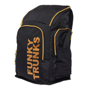 A black Funky Trunks backpack with gold trim and the brand name 'Funky Trunks' printed in gold on the front.
