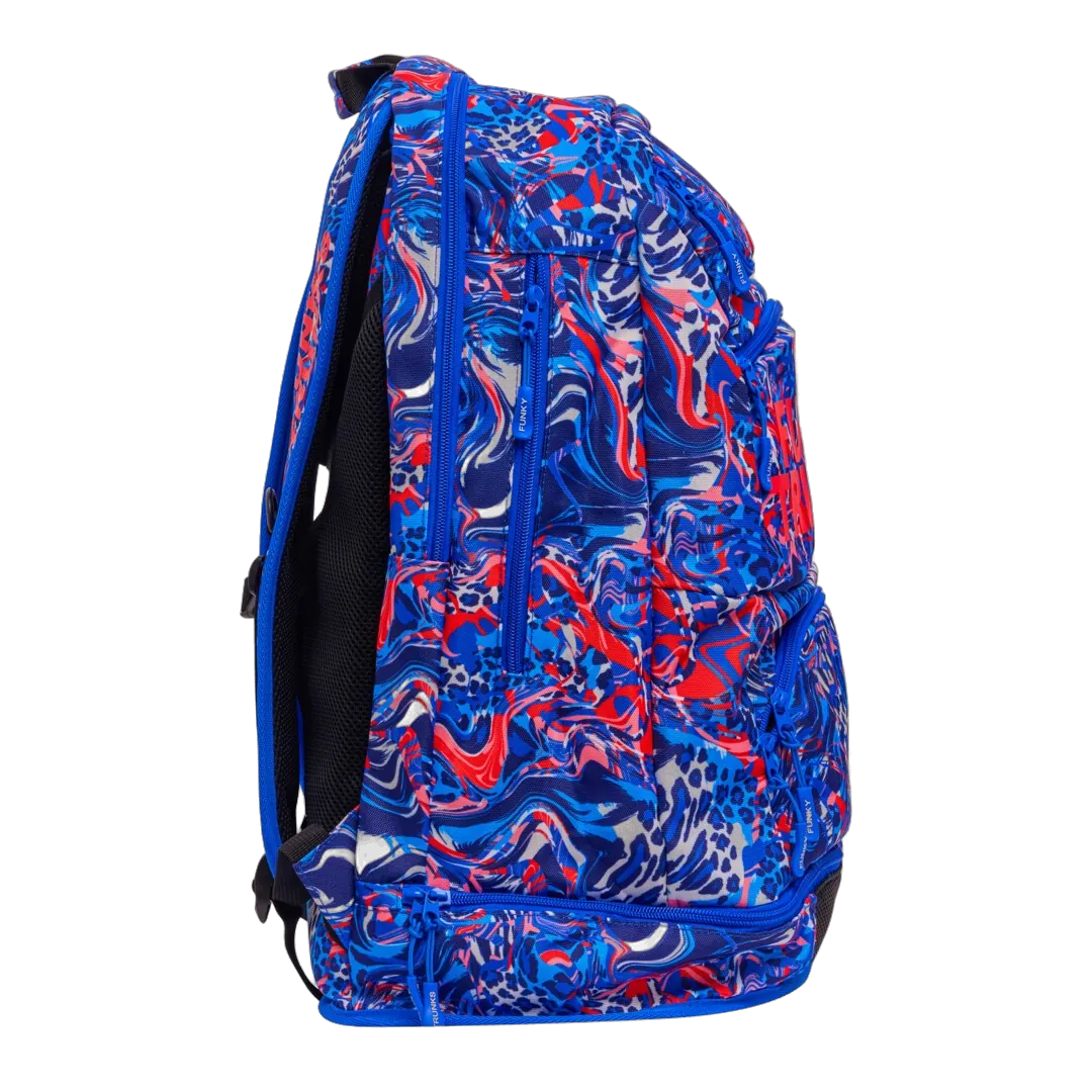 Blue and red patterned swimming backpack with 'Funky Trunks' branding with pockets opened zips closed