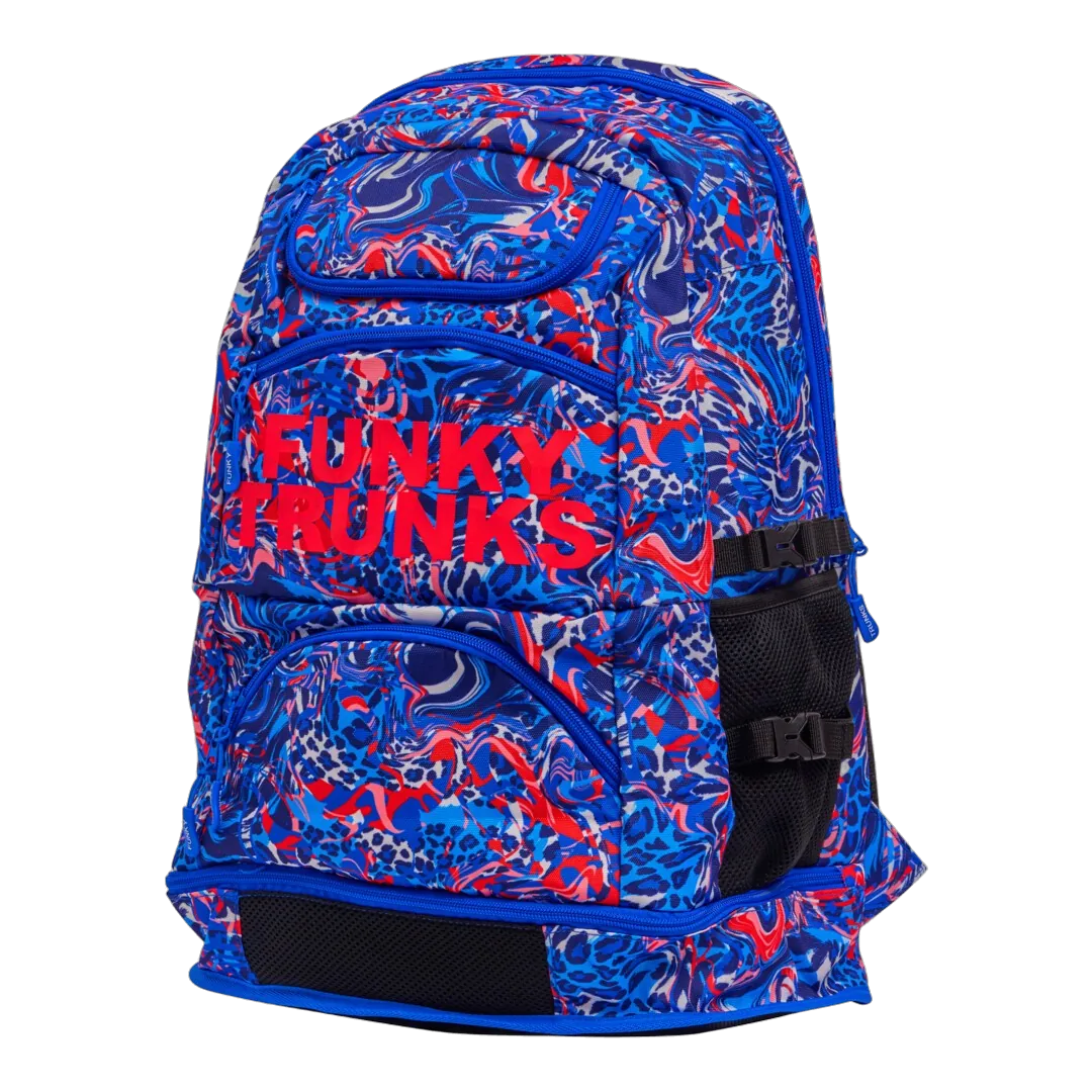 Blue and red patterned swimming backpack with 'Funky Trunks' branding on an angled view