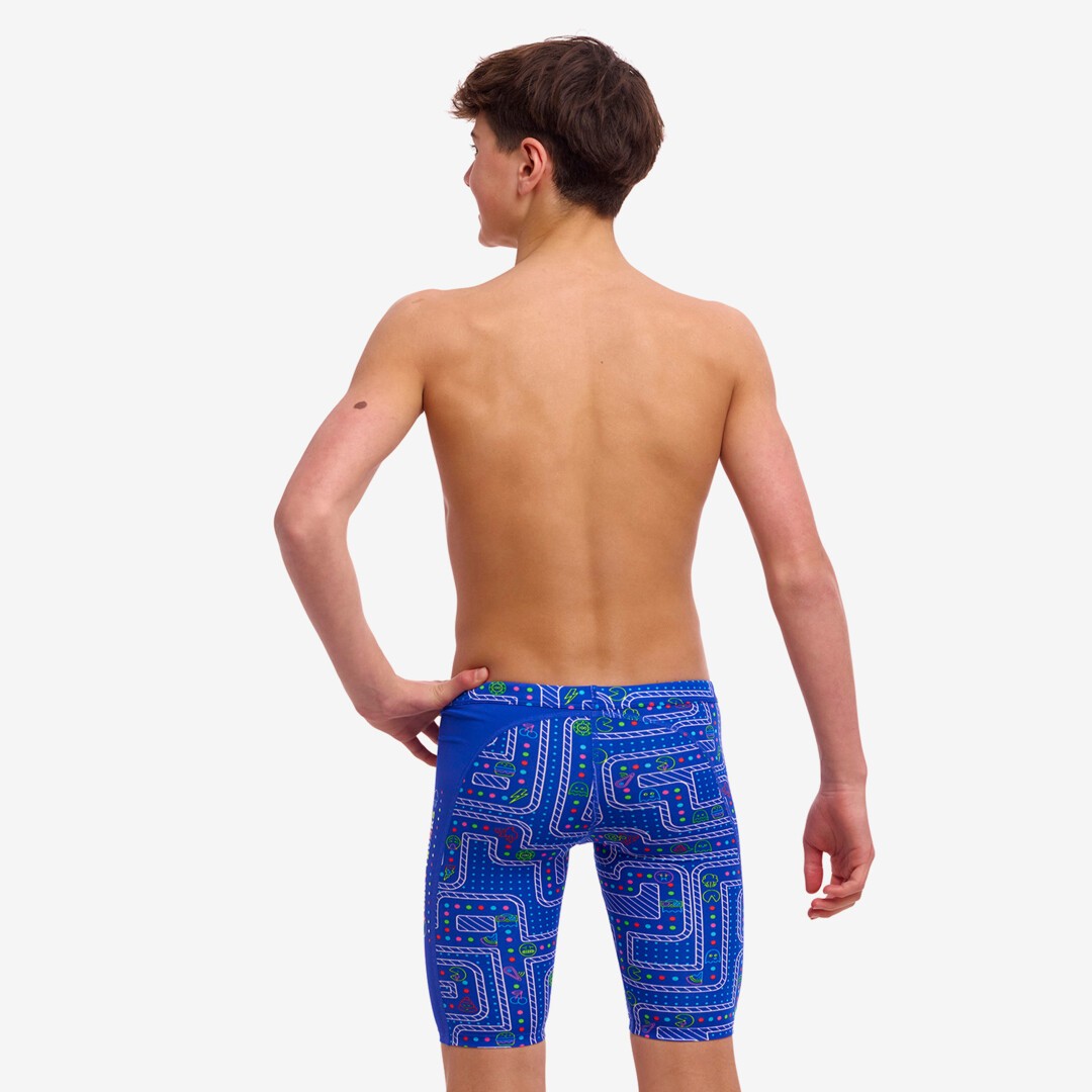 Back view of a boy wearing multicoloured Funky Trunks Much Munchies Boy's Training jammers.