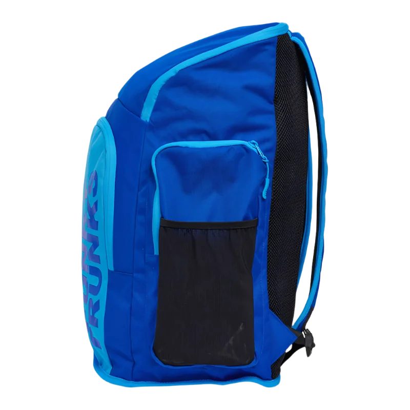 Blue backpack with 'Funky Trunks' branding on a side angle