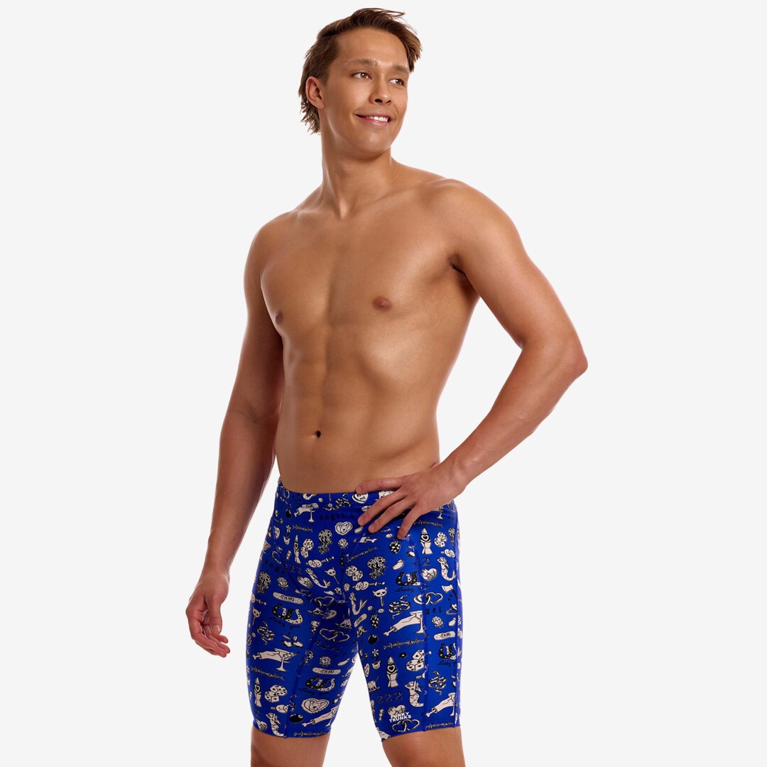 A shirtless male model with his head turned sideways wearing blue swimming jammers with a white "scratchy" pattern from Funky Trunks 