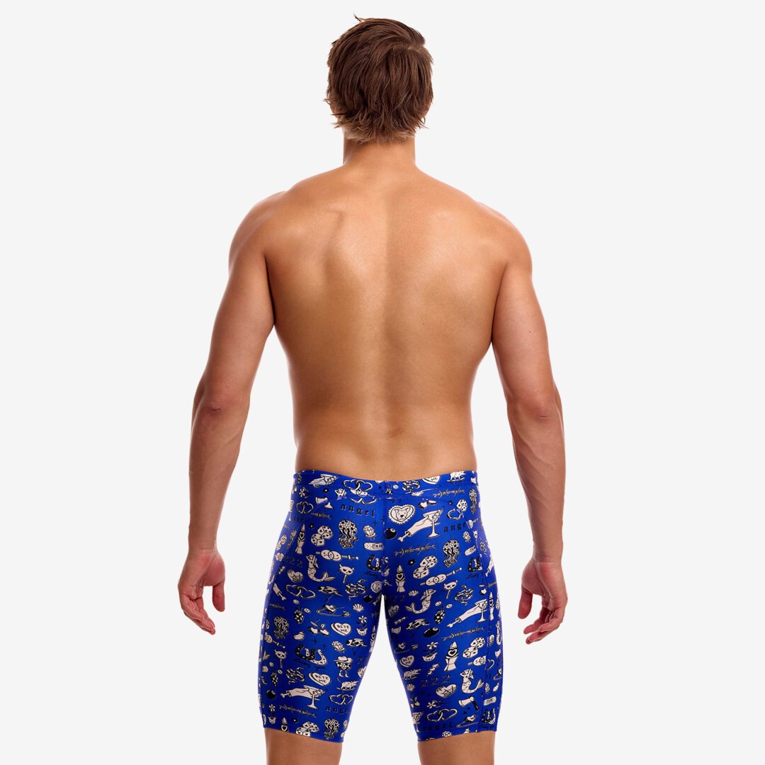 A shirtless male model with his back to the camera swearing blue swimming jammers with a white "scratchy" pattern from Funky Trunks. 
