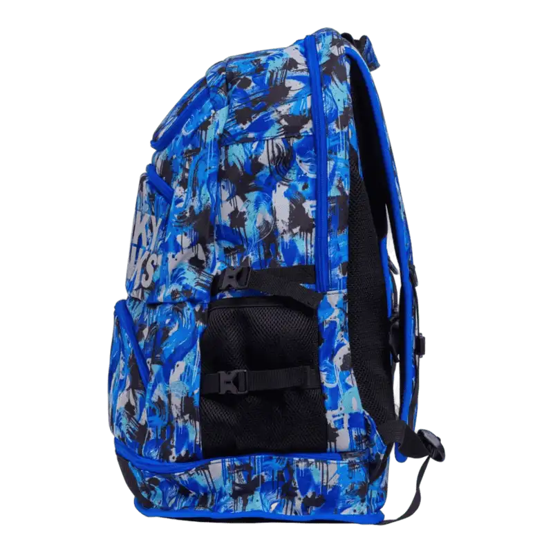 Blue and black patterned backpack with 'Funky Trunks' branding viewed from left side