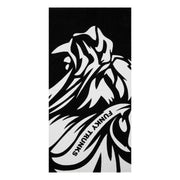 Black and white patterned towel with a roaring  lion face and 'Funky Trunks' branding on a white background
