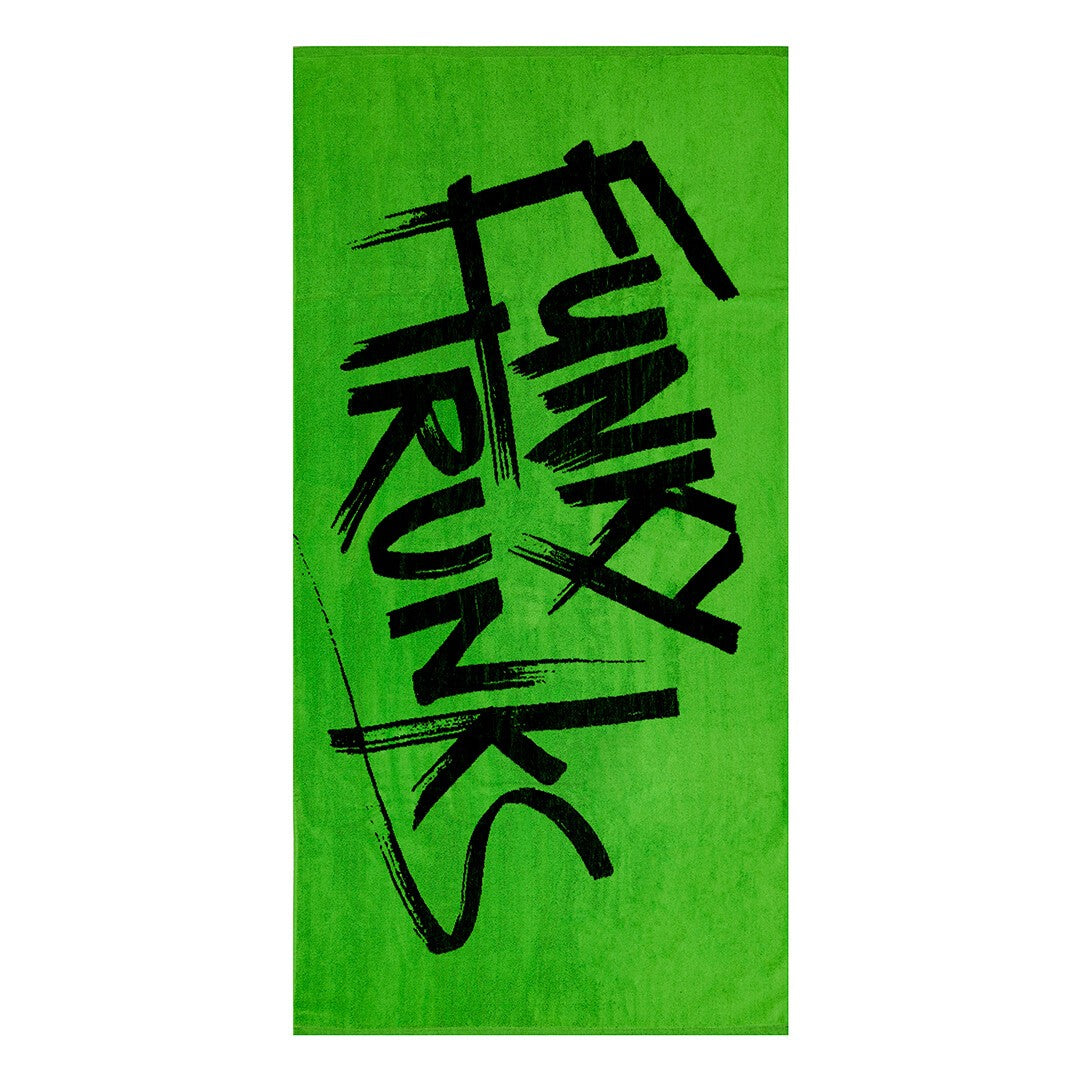 Green towel with 'Funky Trunks' text in black on a white background