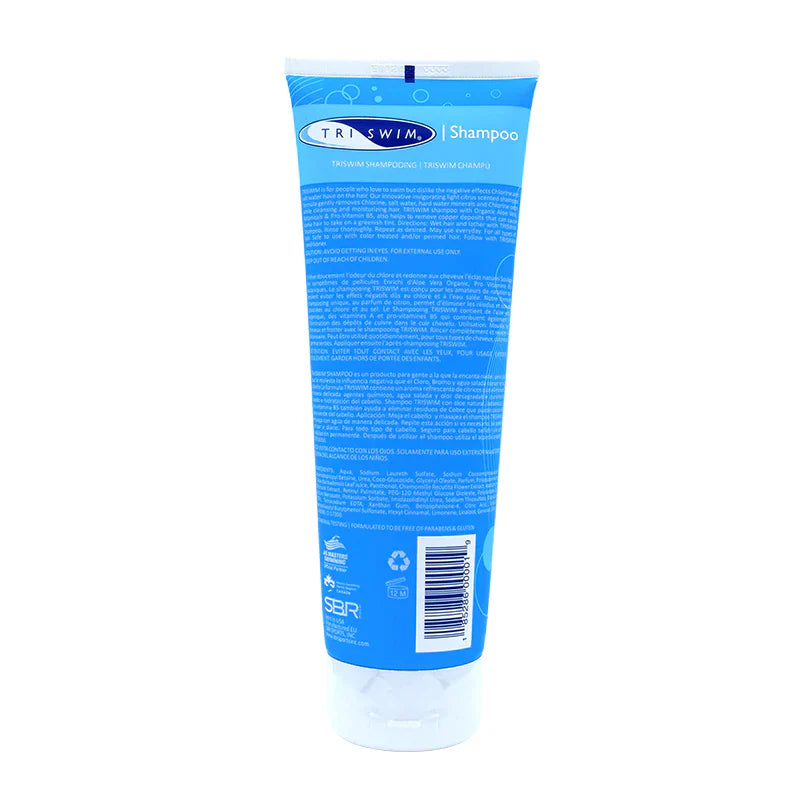 Back view of a tube of TRISWIM Chlorine Removal Shampoo with highlights of lime and tropical mango, indicating its scent. The packaging is blue and shows product ingredients.