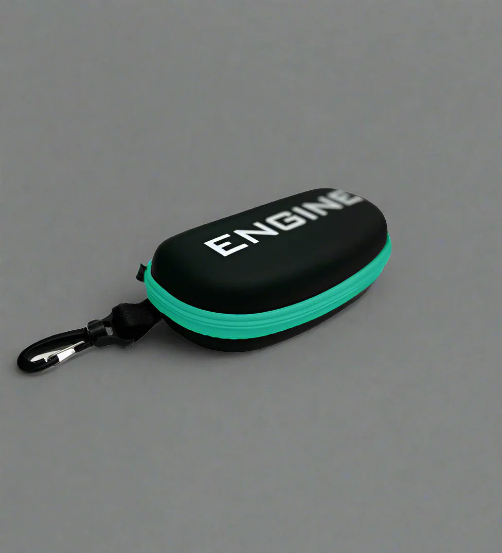 Side view of black goggle case with 'ENGINE' branding on and turquoise trim