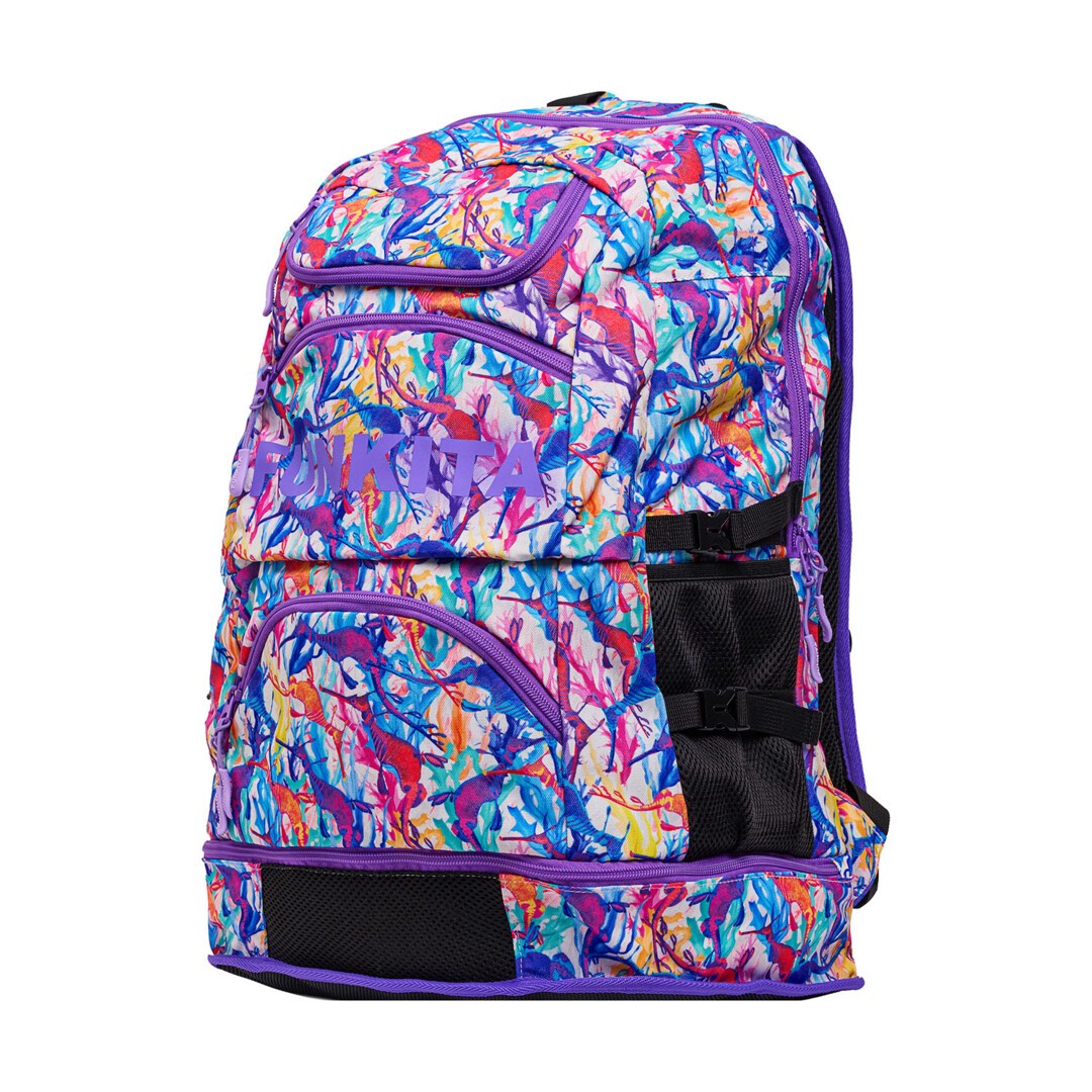 Front view of a colourful backpack with a vibrant pattern with purple 'Funkita' branding on a white background