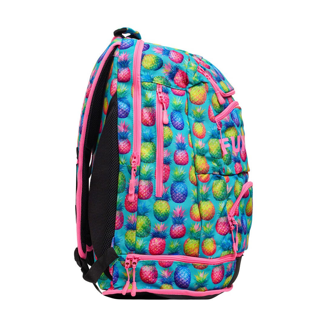 Side view of a colourful backpack with fun pineapple pattern, multiple zips and 'Funkita' branding on a white background