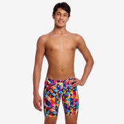 Person wearing colourful geometric patterned swim jammers on a white background